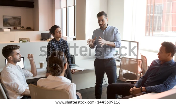 stockphoto of man coaching during meeting