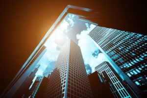 upward view of skyscrapers with sun reflection