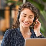 young women talking on the phone with headphones on
