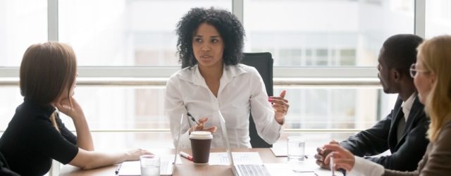 black women leading a meeting