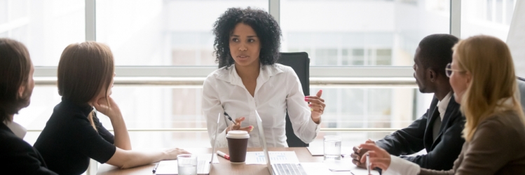 black women leading a meeting