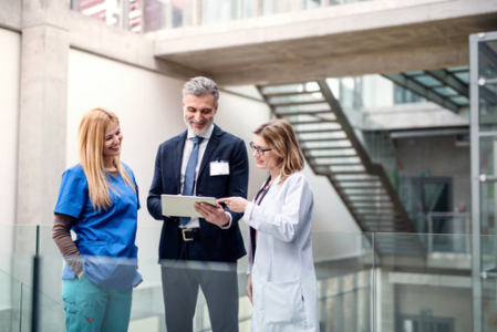 healthcare workers looking at tablet