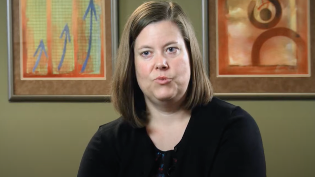 Woman speaking in video thumbnail