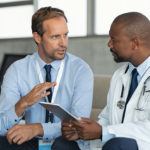 Two men discussing sales training