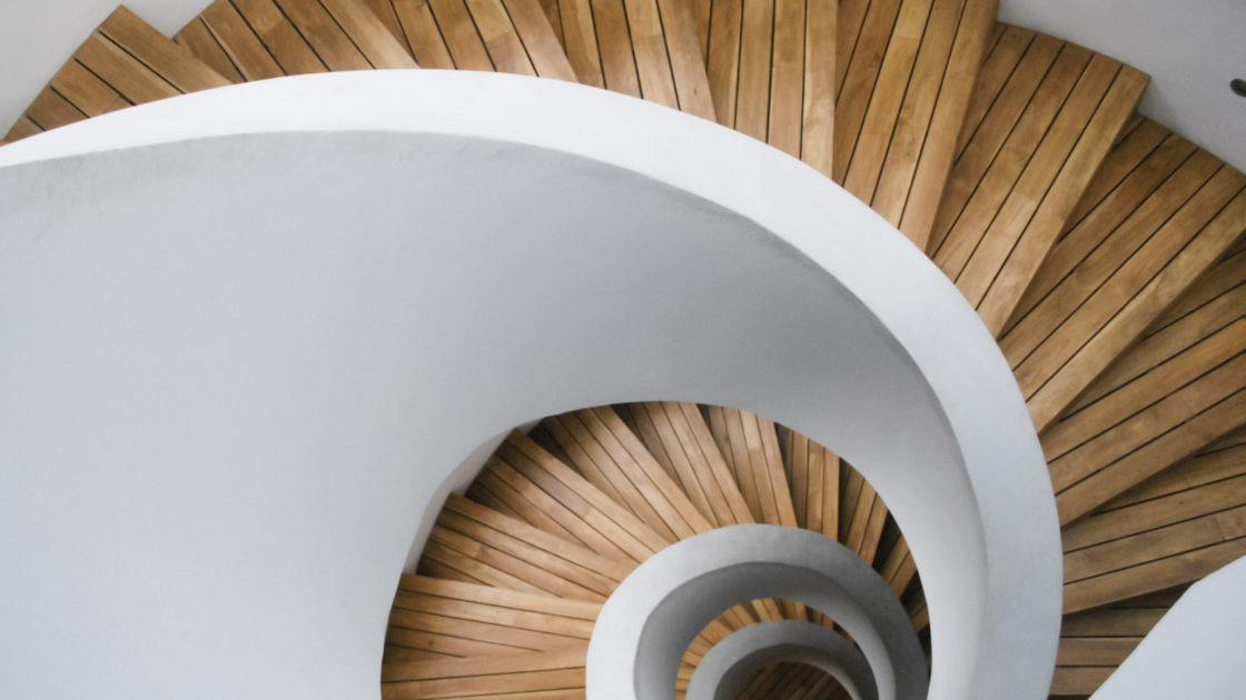 Modern spiral staircase with wooden planks