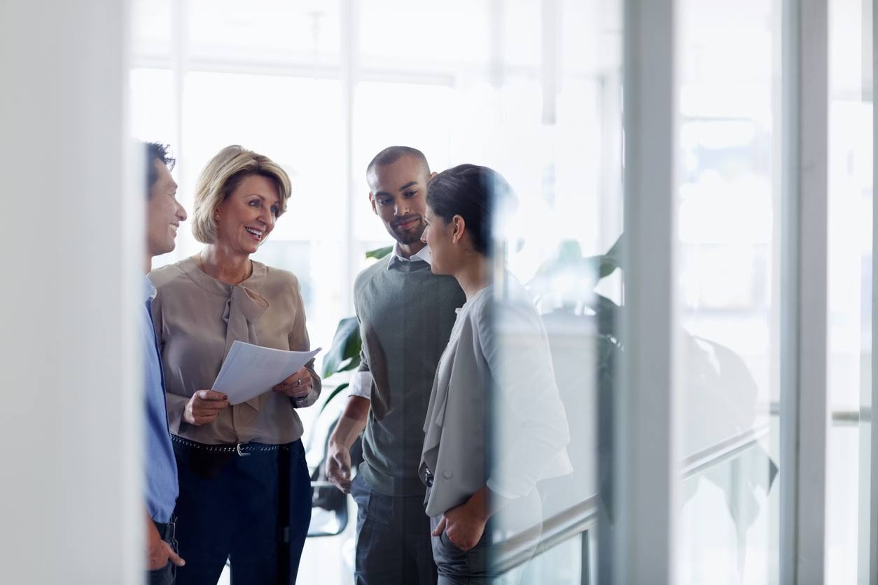 Businesswoman discussing with colleagues