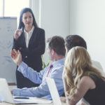 Group of business people in a boardroom presentation.
