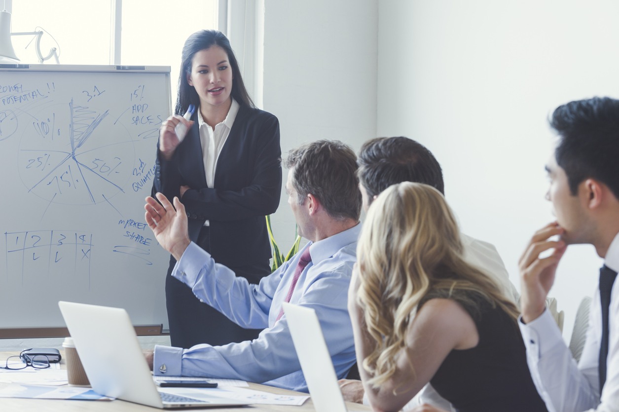Group of business people in a boardroom presentation.