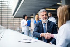 man shaking hand with customer