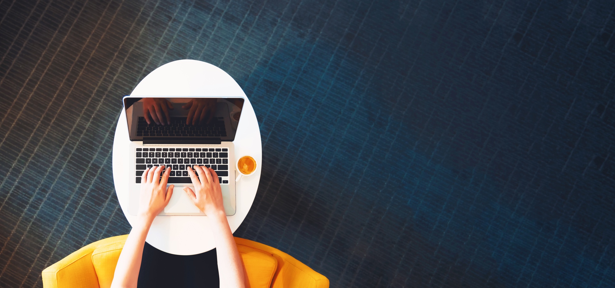 overhead view of women on laptop