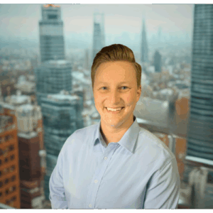 Professional headshot of E. Holldorf smiling in a corporate setting.