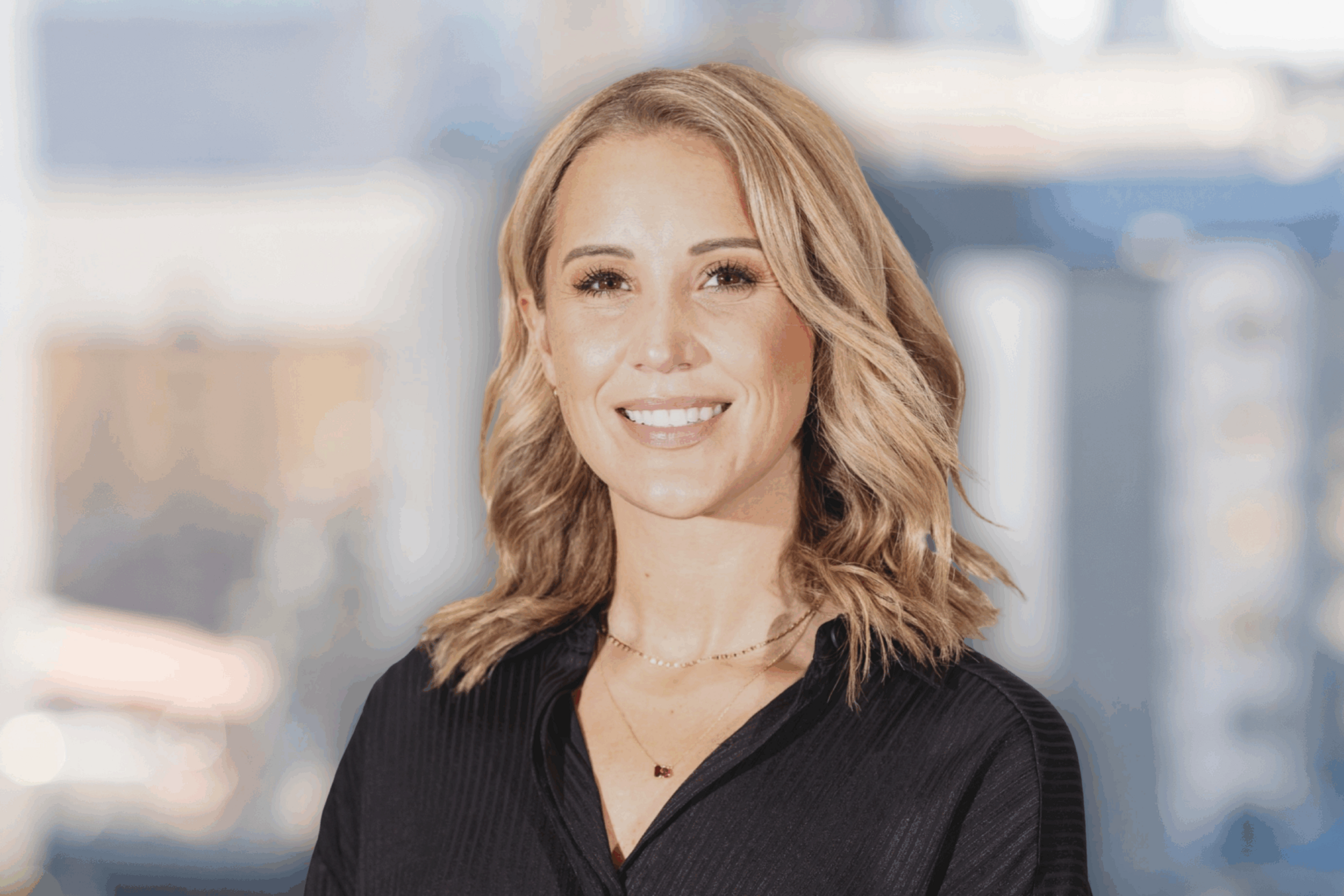Professional headshot of Jess Rose smiling against a high-key neutral background.
