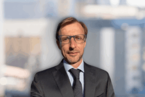Professional headshot of Federico Boldrin smiling against a neutral background.