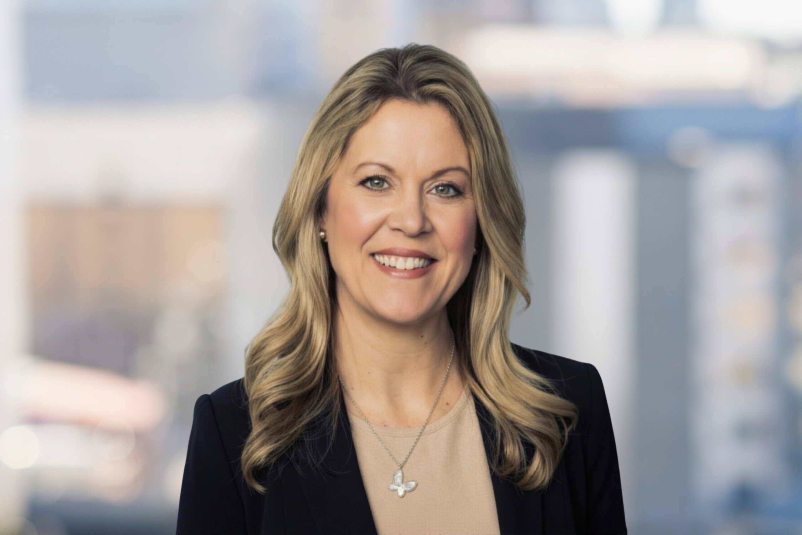 A professional headshot of Nicole Marino